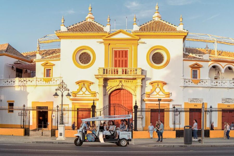 Seville: Private City Tour by Eco Tuk Tuk - Along the river to the Torre del Oro