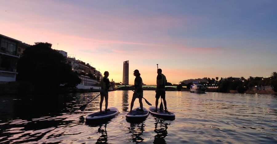 Seville: Sunset and Evening Paddle Boarding Tour - Meeting the river on C. Betis