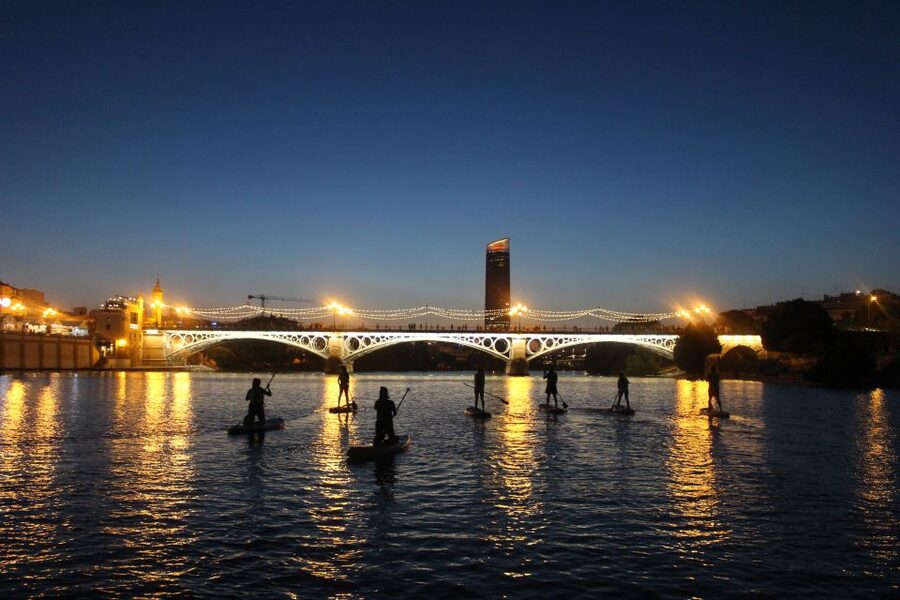 Seville: Sunset and Evening Paddle Boarding Tour - Passing beneath Seville’s famous bridges