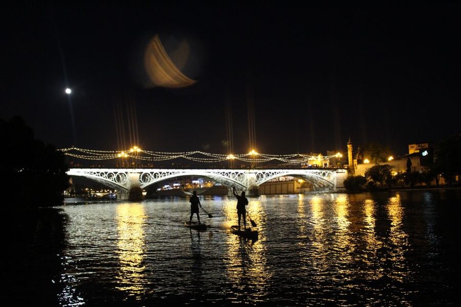 Seville: Sunset and Evening Paddle Boarding Tour - What makes the guide important