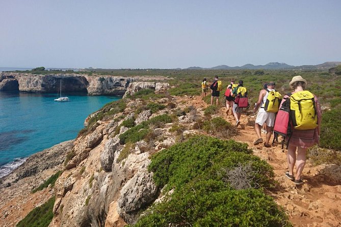 Small-Group Cova de Coloms Sea Caving Tour in Mallorca - Wetsuits, helmets, and the swim to the entrance
