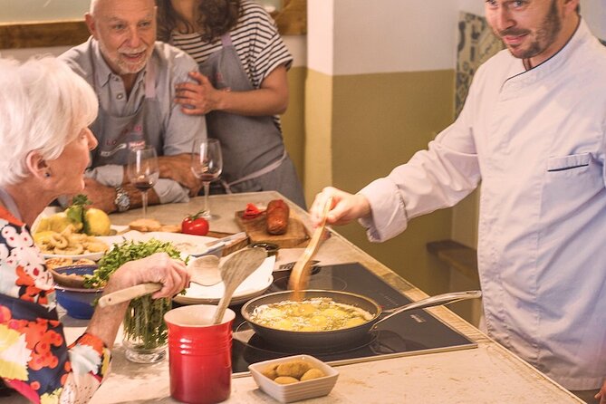 Spanish Cooking Experience in Mallorca - Building a mixed paella with meat and fish