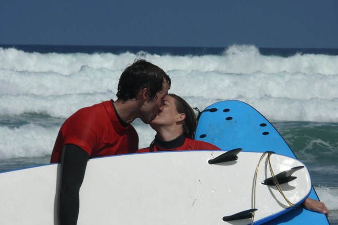 Surf class in Famara 9:15-12:00 or 11:45-14:30 (2h class) - At Av. el Marinero, 13: getting ready