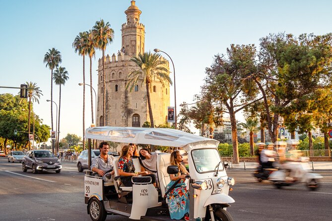 Tour Welcome Seville with Local Guide in Eco Tuk Tuk Private - River views, the Golden Tower, and the bullring