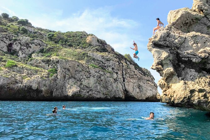 Uncharted Marine Reserve Cave, Snorkel & Cliff Jumping Kayak Tour - Cliff jumping at Cala Tango