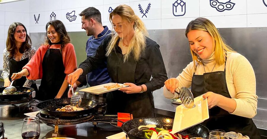 Valencia: Paella Cooking Class with Central Market Tour - Cooking paella at your own station