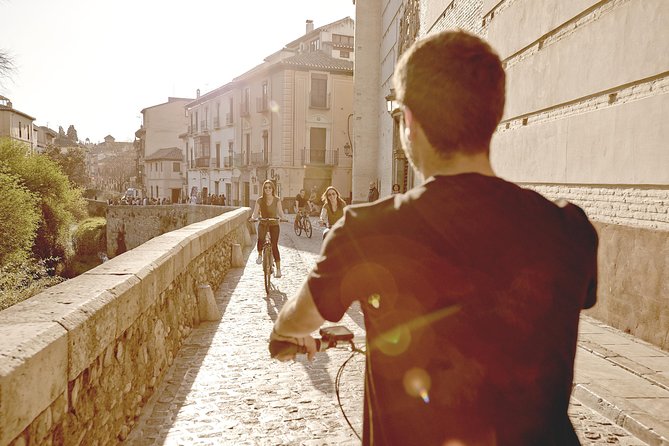 Zooming Through Granada: A Fun-Filled Electric Bike Tour - The climb toward Abadia del Sacromonte